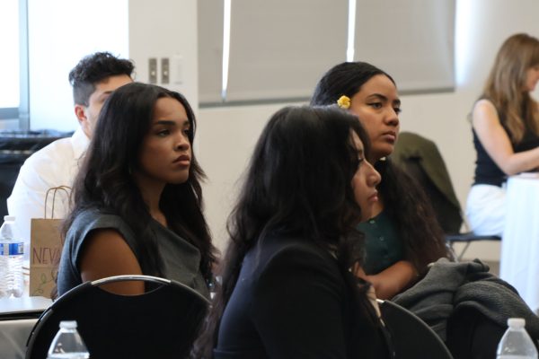 Fellows (Nevaeh Parker, LeNora Suguturaga, and Scarlet Urey) listen in to Dean Kronk Warner’s words of wisdom.