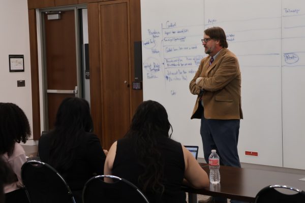 Professor Brigham Daniels teaching a mock law class to the Pre-Law Fellows.