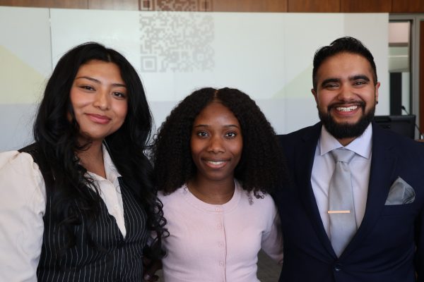 Pre-Law Fellows (Scarlet Urey, Kimley Morlant, and Maximus Garcia-Olazabal) gather together for a photo in celebration.